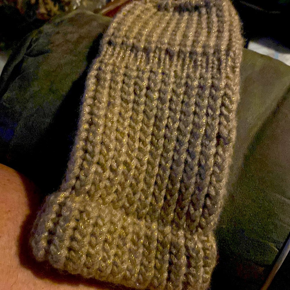 Handmade fingerless gloves the are brown with gold specks in them
